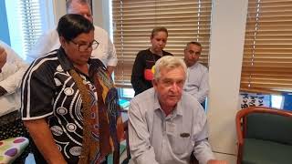 Captain Hoody reads and signs the list of people's demands to SCOMO!